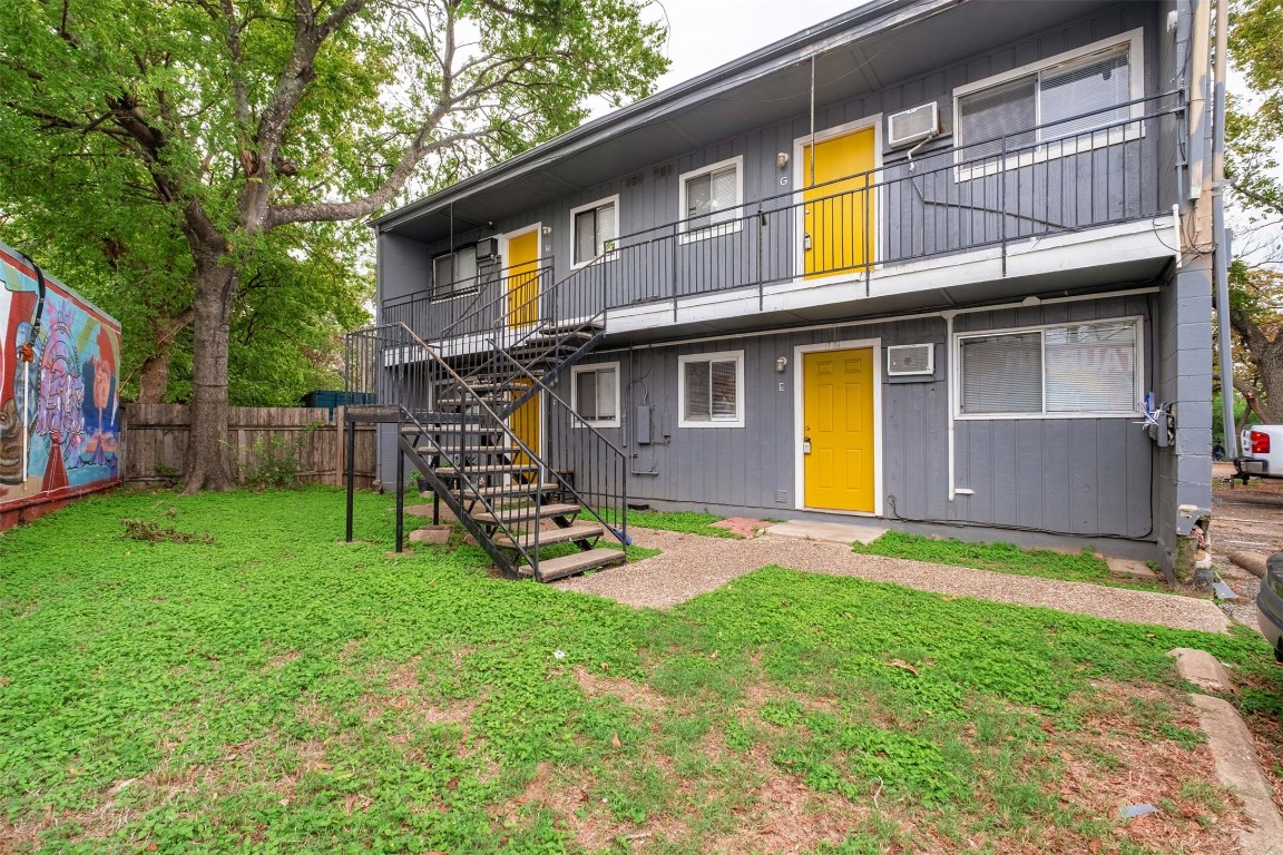 903 Springdale Road, Unit E Austin, TX 78702 - Photo 15 of 16 Rear view of property featuring stairs and a balcony