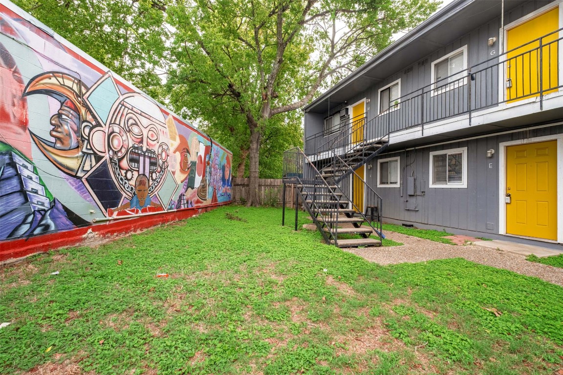 903 Springdale Road, Unit E Austin, TX 78702 - Photo 16 of 16 View of yard with stairway and a balcony