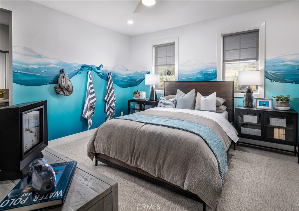 20320 Marlow Lane Porter Ranch, CA 91326 - Photo 14 of 16 a bedroom with a bed and large windows