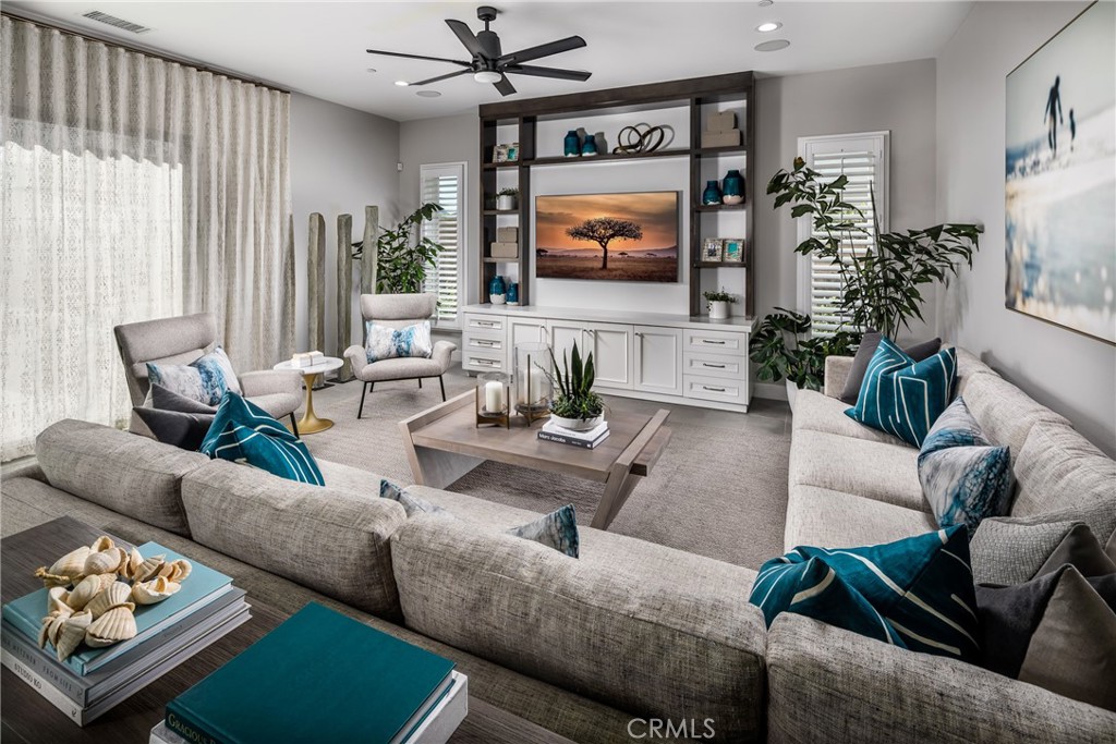 20320 Marlow Lane Porter Ranch, CA 91326 - Photo 3 of 16 a living room with furniture and a flat screen tv