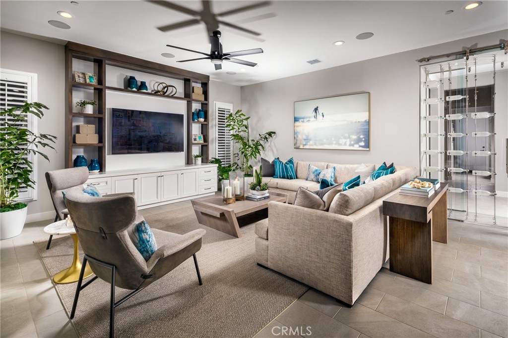 20320 Marlow Lane Porter Ranch, CA 91326 - Photo 4 of 16 a living room with furniture and a flat screen tv
