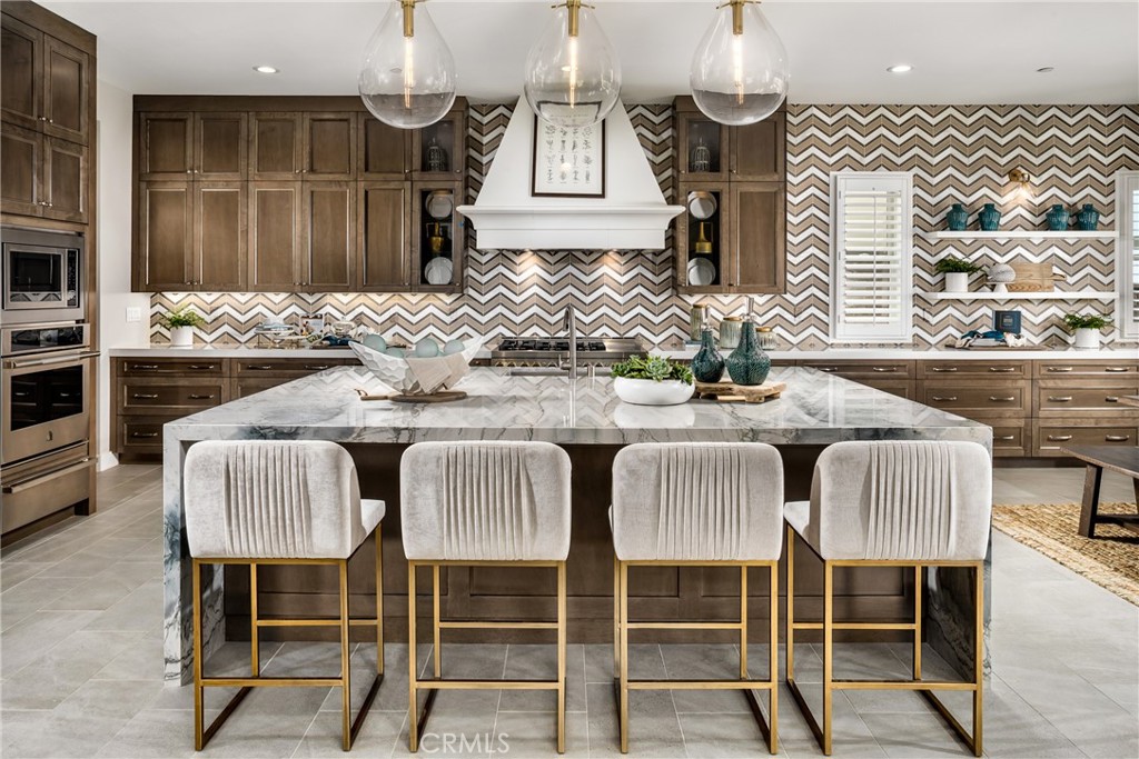 20320 Marlow Lane Porter Ranch, CA 91326 - Photo 6 of 16 a view of a dining room with furniture
