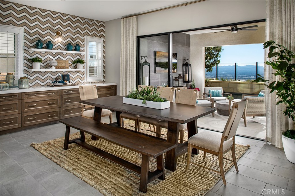 20320 Marlow Lane Porter Ranch, CA 91326 - Photo 7 of 16 a dining room with a wooden table and chairs