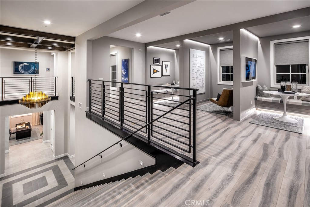 20320 Marlow Lane Porter Ranch, CA 91326 - Photo 9 of 16 a view of a living room and kitchen with furniture and a view of living room