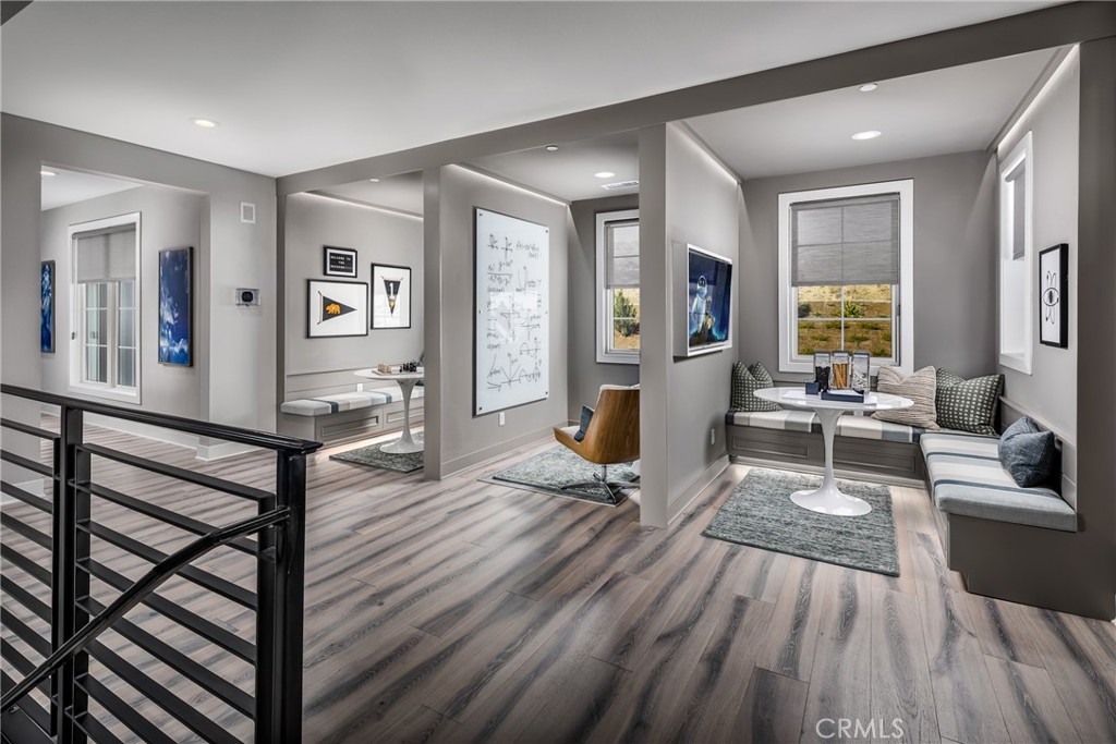 20320 Marlow Lane Porter Ranch, CA 91326 - Photo 10 of 16 a living room with furniture a wooden floor and large windows