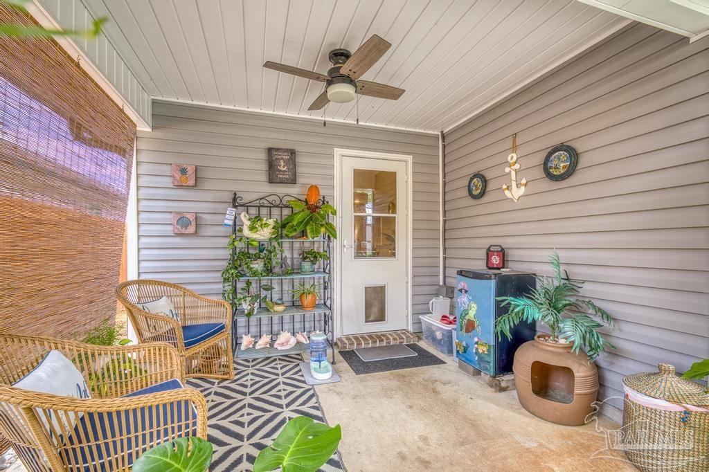 5277 Peach Drive Pace, FL 32571 - Photo 23 of 31 a front view of a house with outdoor seating and stairs
