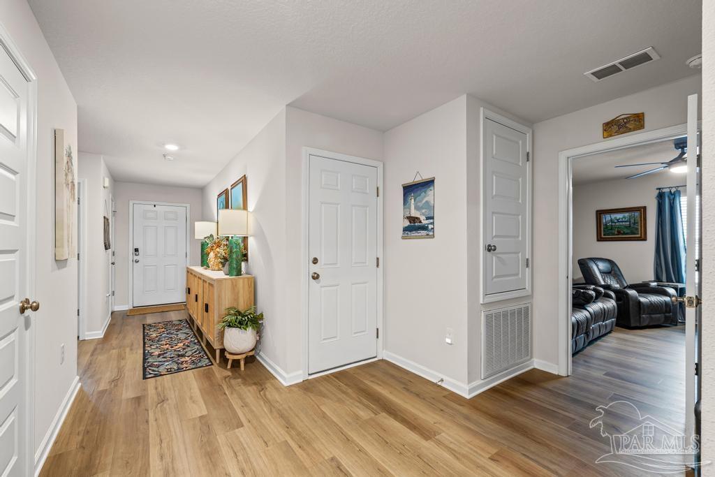 5277 Peach Drive Pace, FL 32571 - Photo 8 of 31 a view of livingroom with furniture and wooden floor