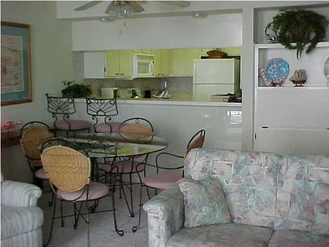 381 Santa Rosa Boulevard, Unit W515 Fort Walton Beach, FL 32548 - Photo 5 of 10 a bedroom with furniture and a chair