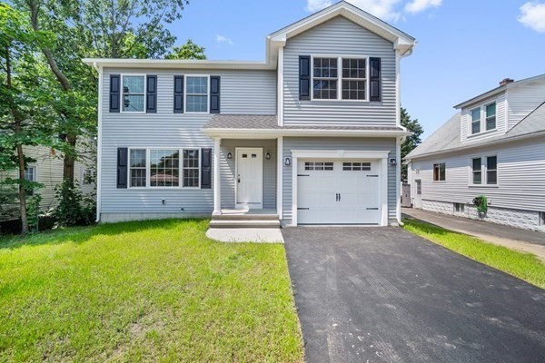16 Ivan Springfield, MA 01104 - Photo 1 of 27 a front view of a house with yard and green space