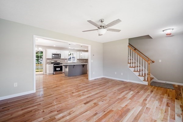 16 Ivan Springfield, MA 01104 - Photo 11 of 27 a view of kitchen and empty room with wooden floor