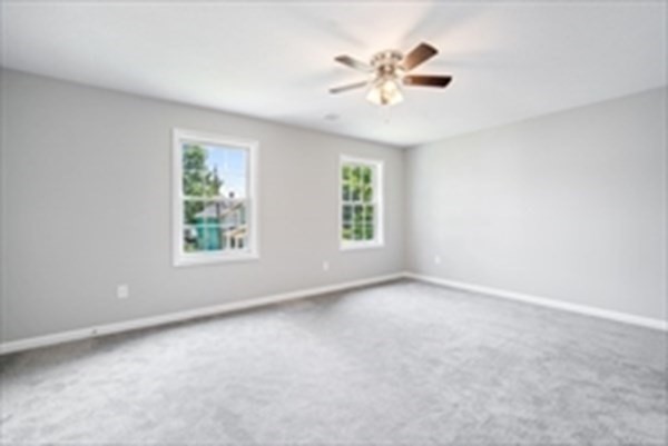 16 Ivan Springfield, MA 01104 - Photo 15 of 27 an empty room with windows and chandelier fan