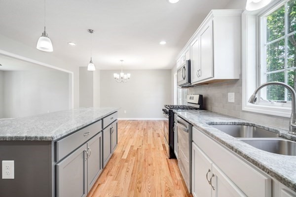 16 Ivan Springfield, MA 01104 - Photo 6 of 27 a kitchen with granite countertop a sink and a stove