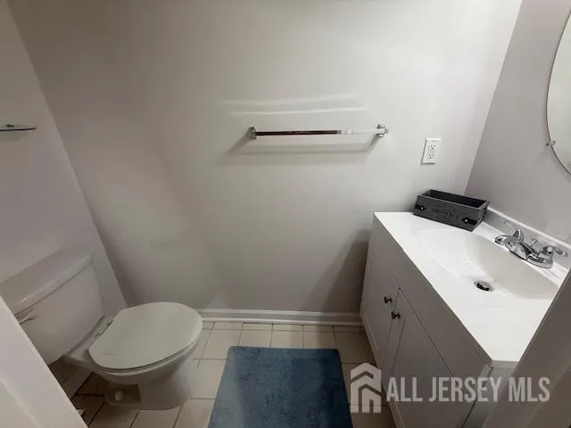 a bathroom with a sink toilet and vanity