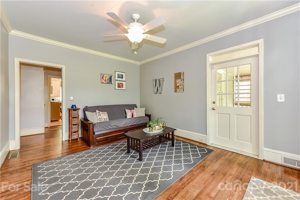 1405 Lilac Road Charlotte, NC 28209 - Photo 15 of 39 a living room with furniture and a table