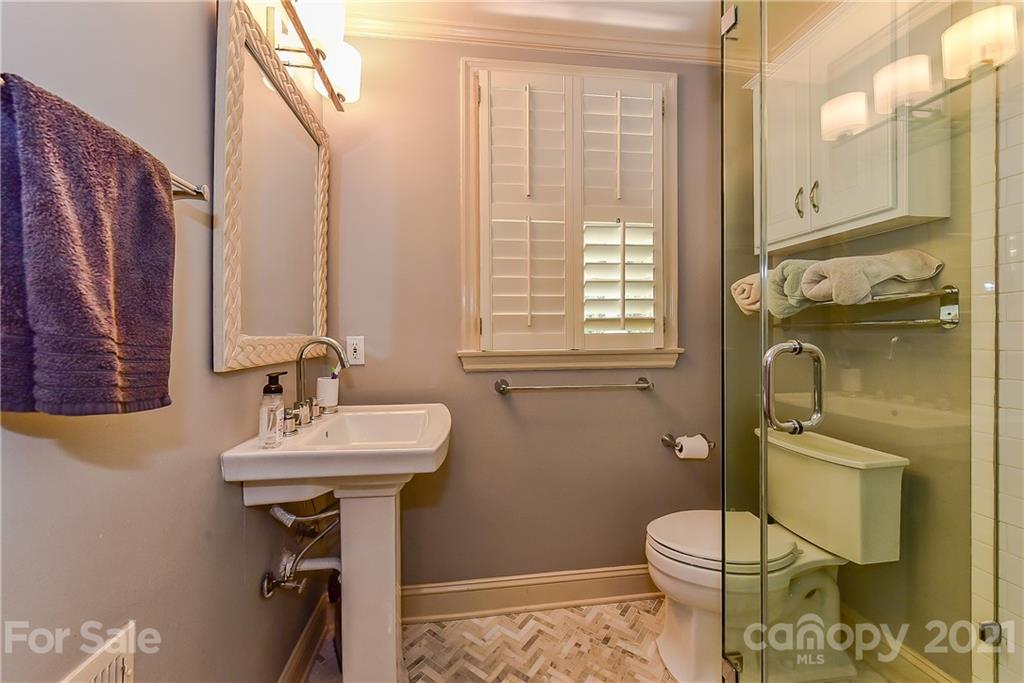 1405 Lilac Road Charlotte, NC 28209 - Photo 18 of 39 a bathroom with a sink toilet and shower