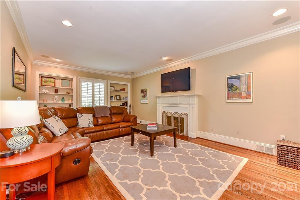 1405 Lilac Road Charlotte, NC 28209 - Photo 3 of 39 a living room with furniture and a fireplace
