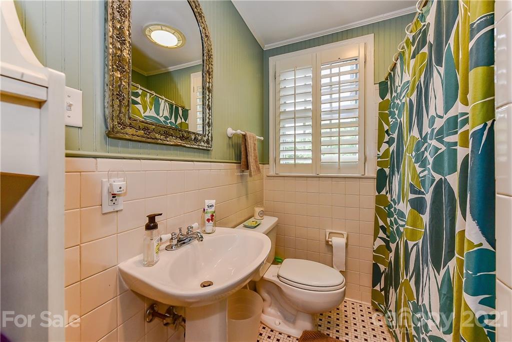 1405 Lilac Road Charlotte, NC 28209 - Photo 21 of 39 a bathroom with a sink and a toilet