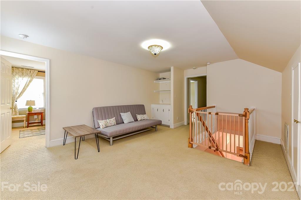 1405 Lilac Road Charlotte, NC 28209 - Photo 23 of 39 a living room with furniture and a window