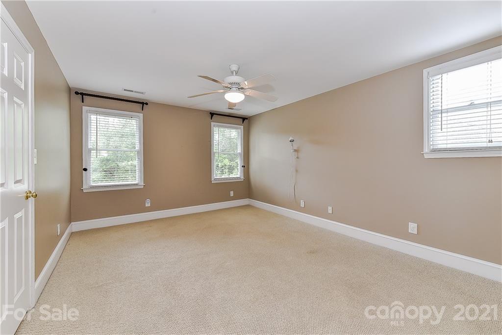 1405 Lilac Road Charlotte, NC 28209 - Photo 26 of 39 a view of an empty room with a window
