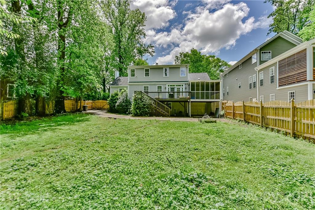 1405 Lilac Road Charlotte, NC 28209 - Photo 34 of 39 a view of a house with backyard and a garden
