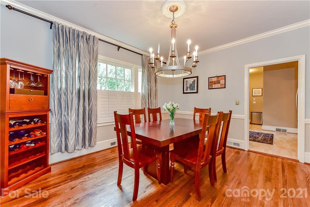 1405 Lilac Road Charlotte, NC 28209 - Photo 8 of 39 a view of a dining room with furniture window and wooden floor