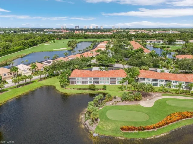 an aerial view of a house with a lake view