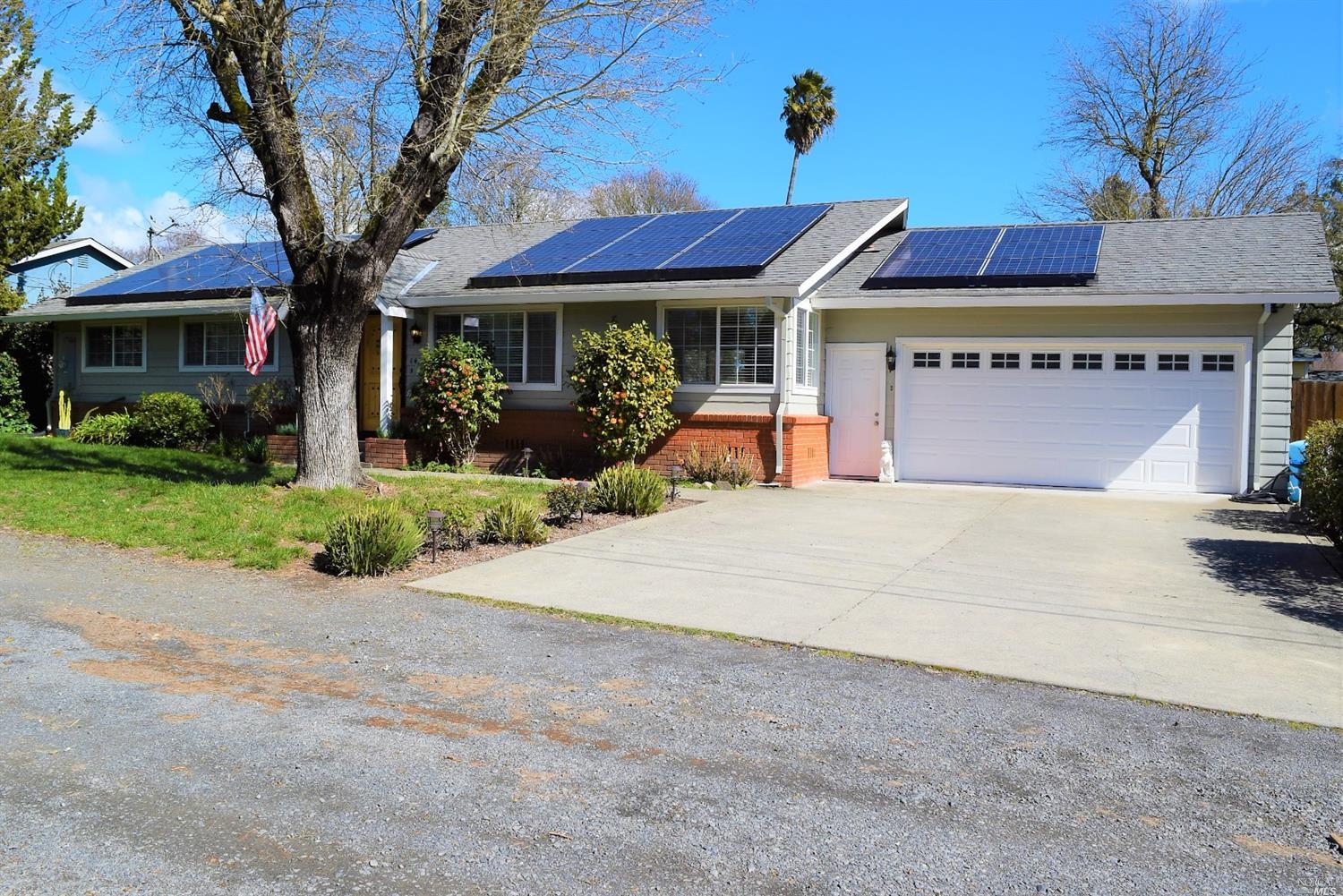 1424 Lawrence Way Santa Rosa, CA 95401 - Photo 1 of 1 a view of a house with patio and a yard