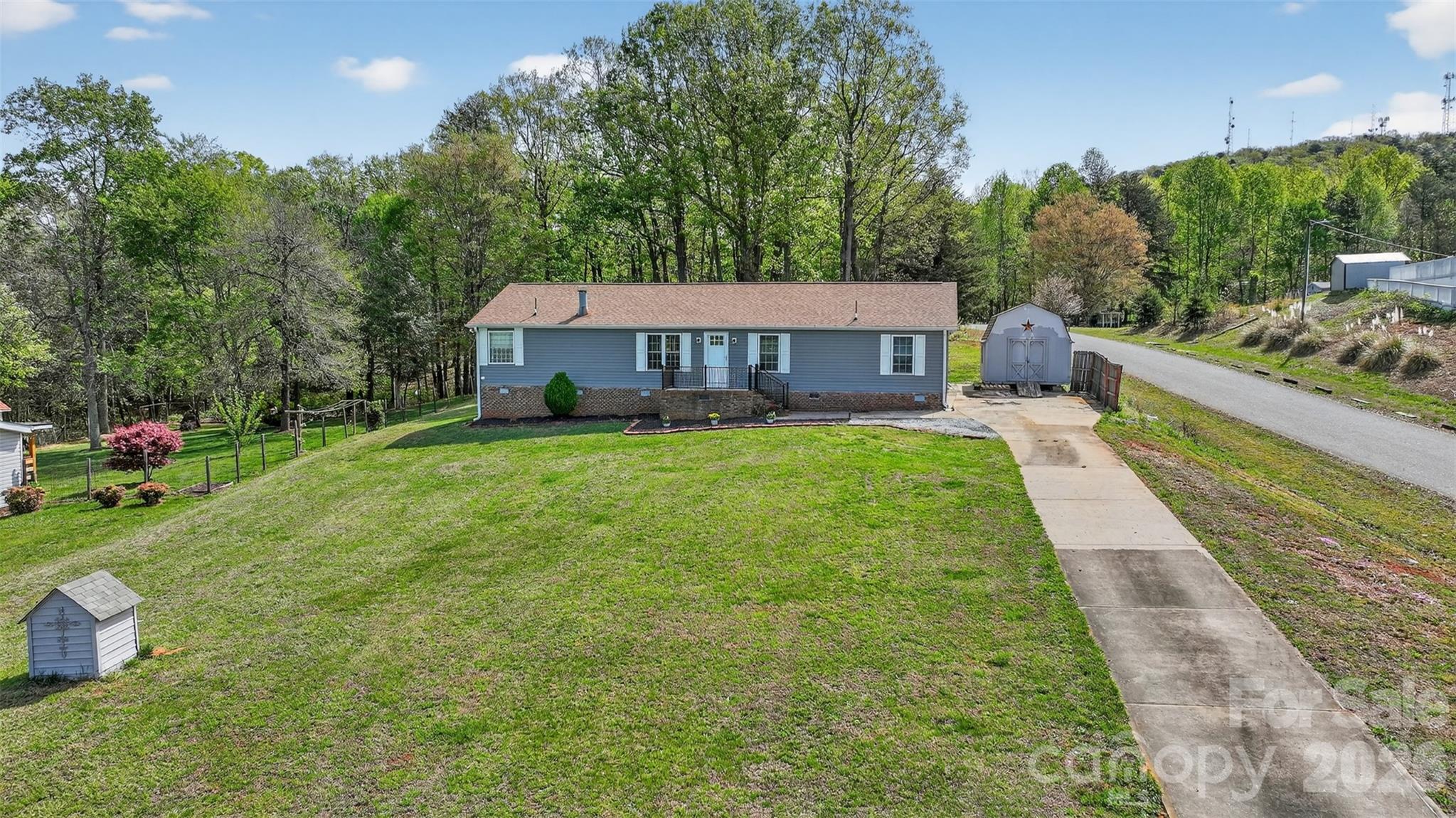4352 Anderson Mountain Road Maiden, NC 28650 - Photo 1 of 42 a view of a house with a yard and sitting area