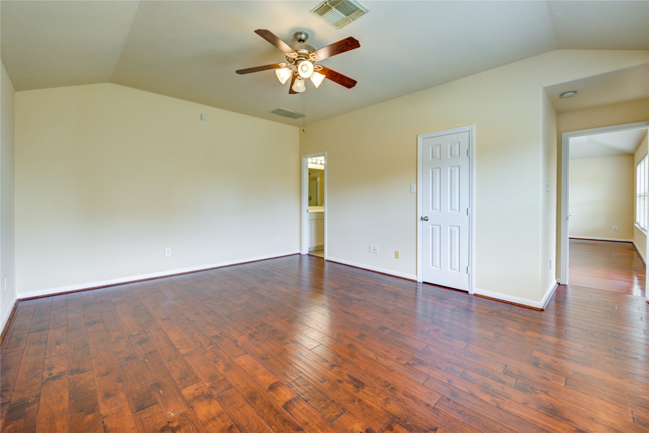 16718 Mackenzie Mesa Drive Spring, TX 77379 - Photo 26 of 50 an empty room with wooden floor and a ceiling fan