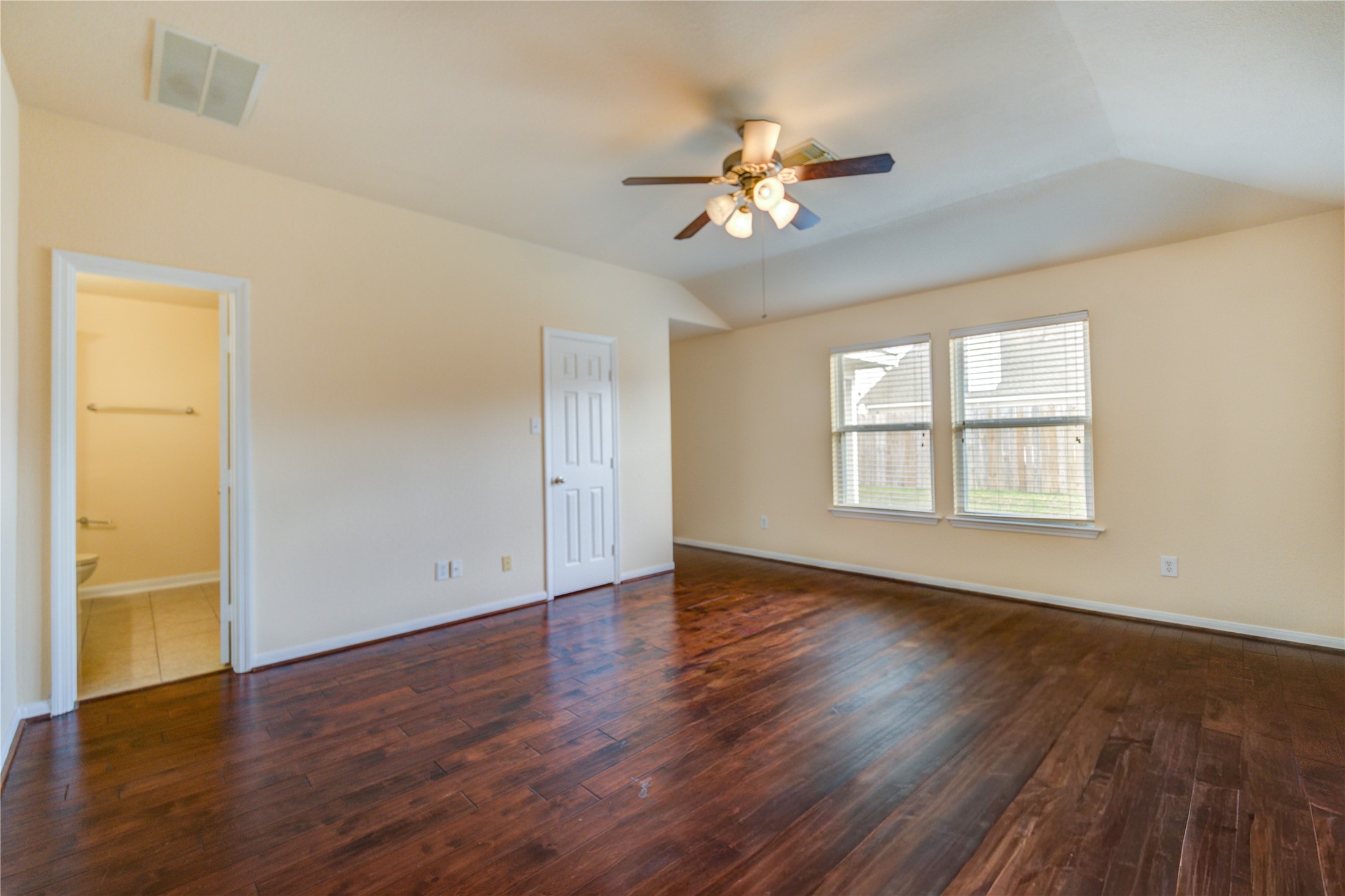 16718 Mackenzie Mesa Drive Spring, TX 77379 - Photo 27 of 50 a view of an empty room with wooden floor and a window
