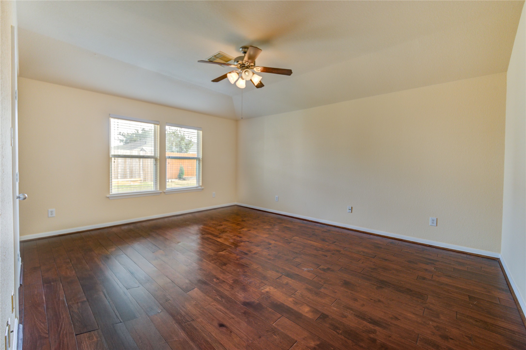 16718 Mackenzie Mesa Drive Spring, TX 77379 - Photo 28 of 50 a view of an empty room with wooden floor and a window