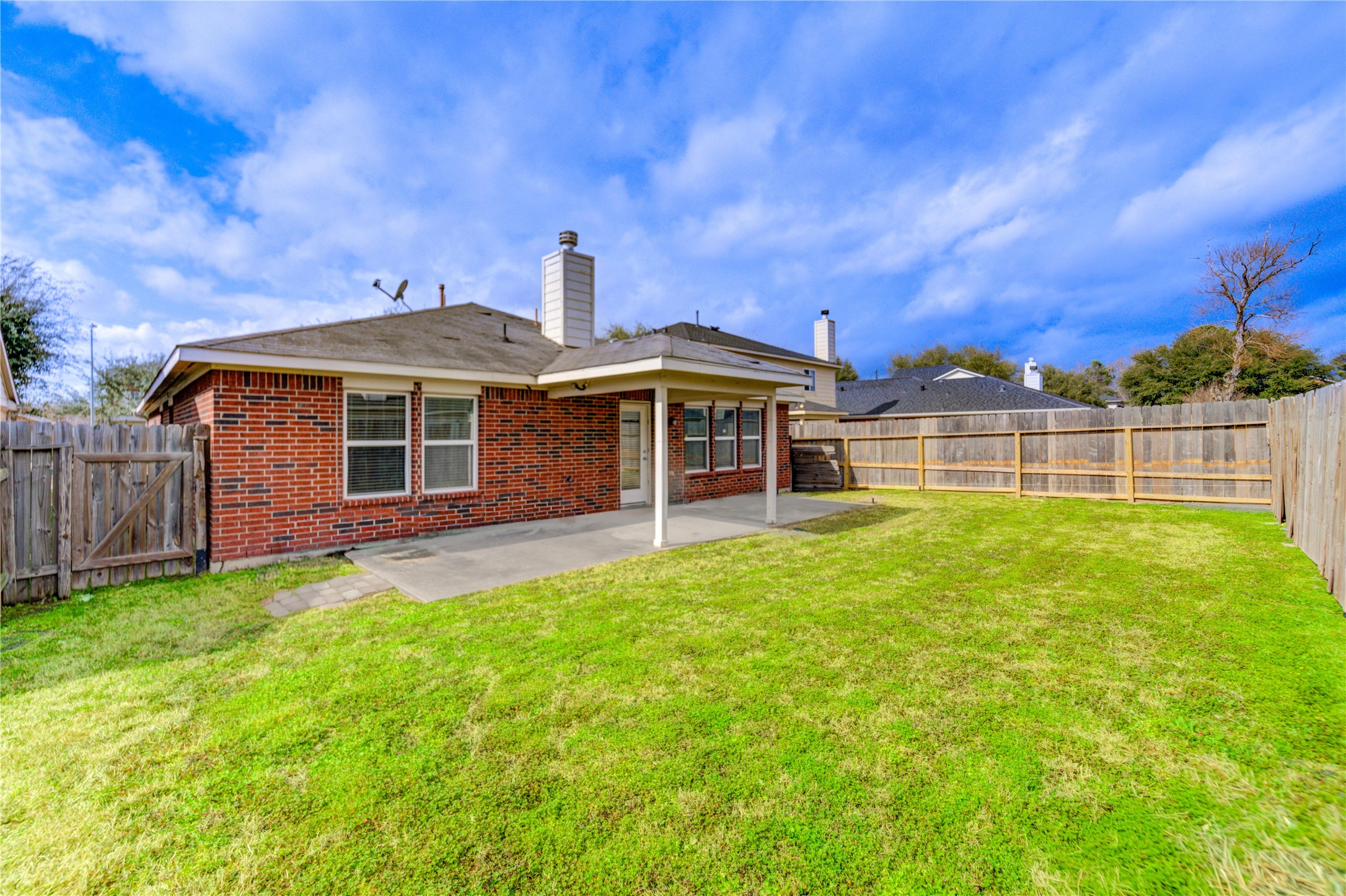 16718 Mackenzie Mesa Drive Spring, TX 77379 - Photo 47 of 50 a front view of a house with a garden