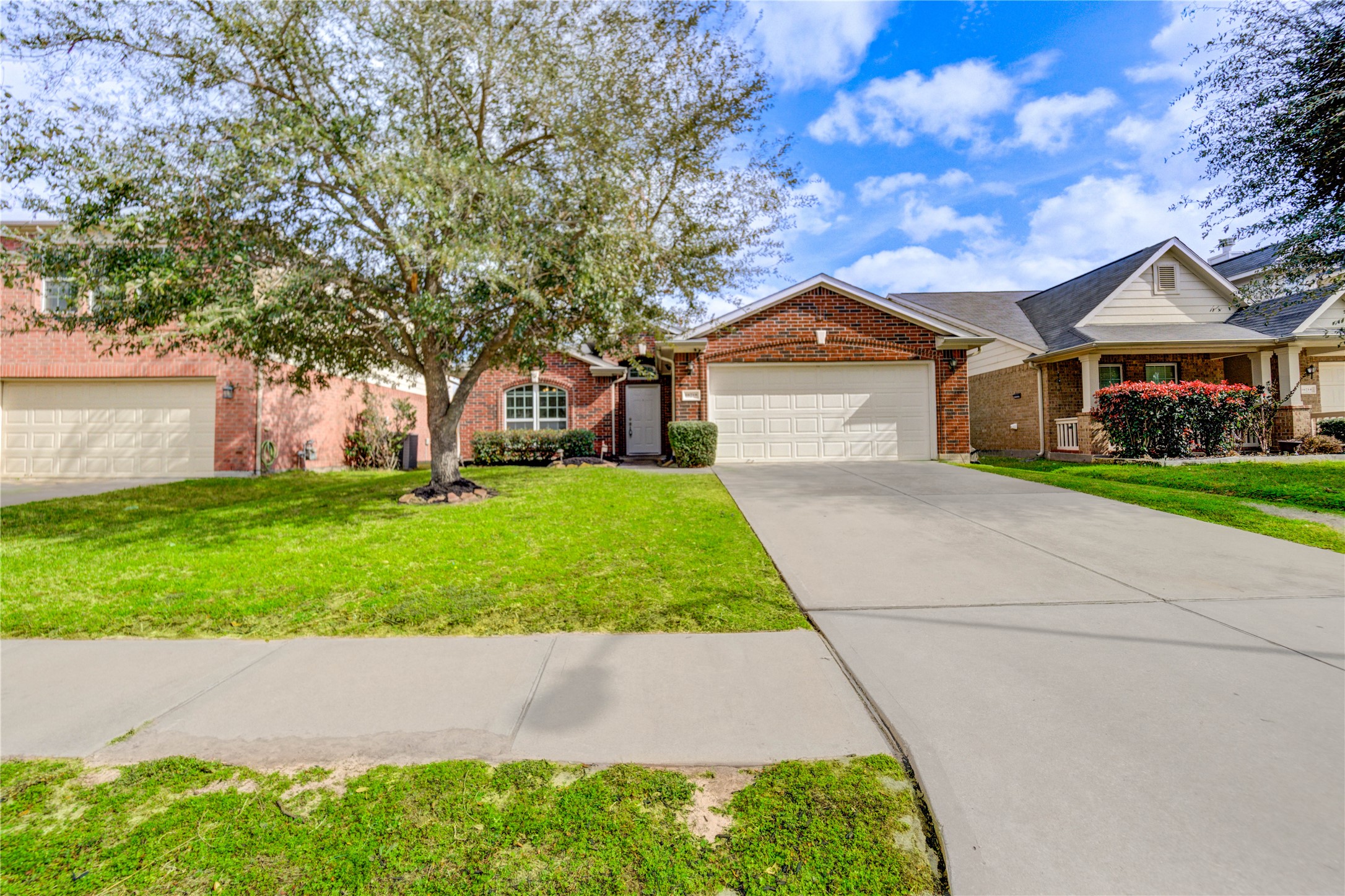 16718 Mackenzie Mesa Drive Spring, TX 77379 - Photo 48 of 50 a front view of house with yard and green space