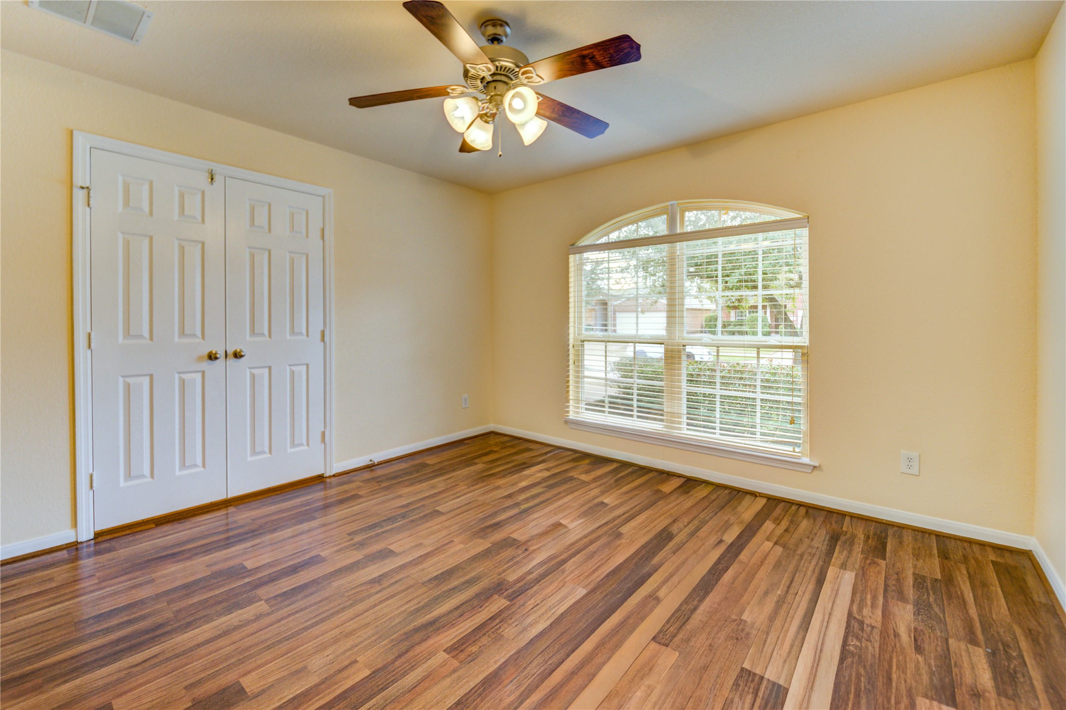 16718 Mackenzie Mesa Drive Spring, TX 77379 - Photo 6 of 50 a view of an empty room with wooden floor and a window
