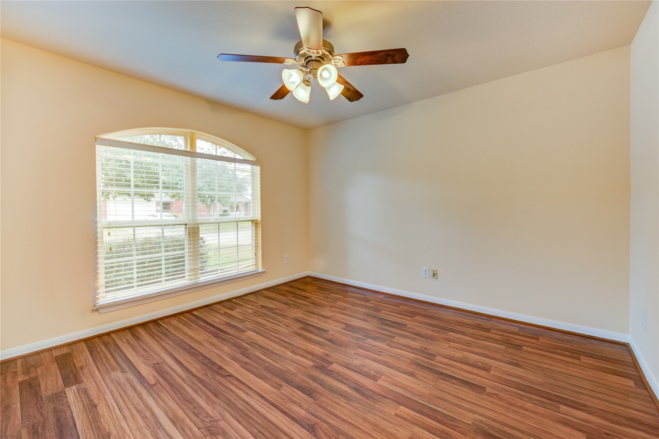 16718 Mackenzie Mesa Drive Spring, TX 77379 - Photo 7 of 50 a view of an empty room with wooden floor and a window
