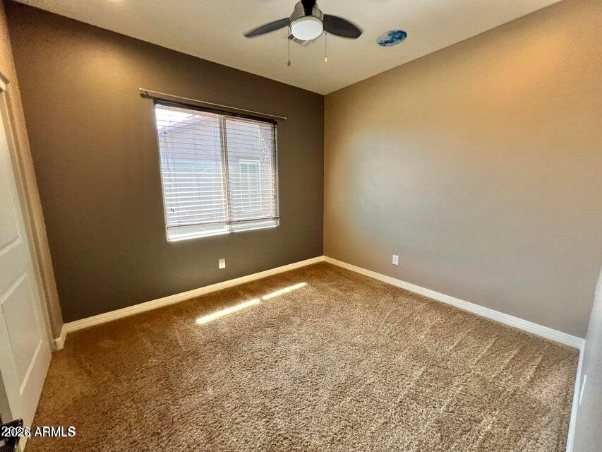 3886 East Rawhide Street Gilbert, AZ 85296 - Photo 32 of 52 an empty room with a window