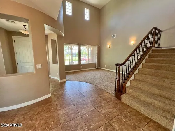 a view of entryway and hall with a window
