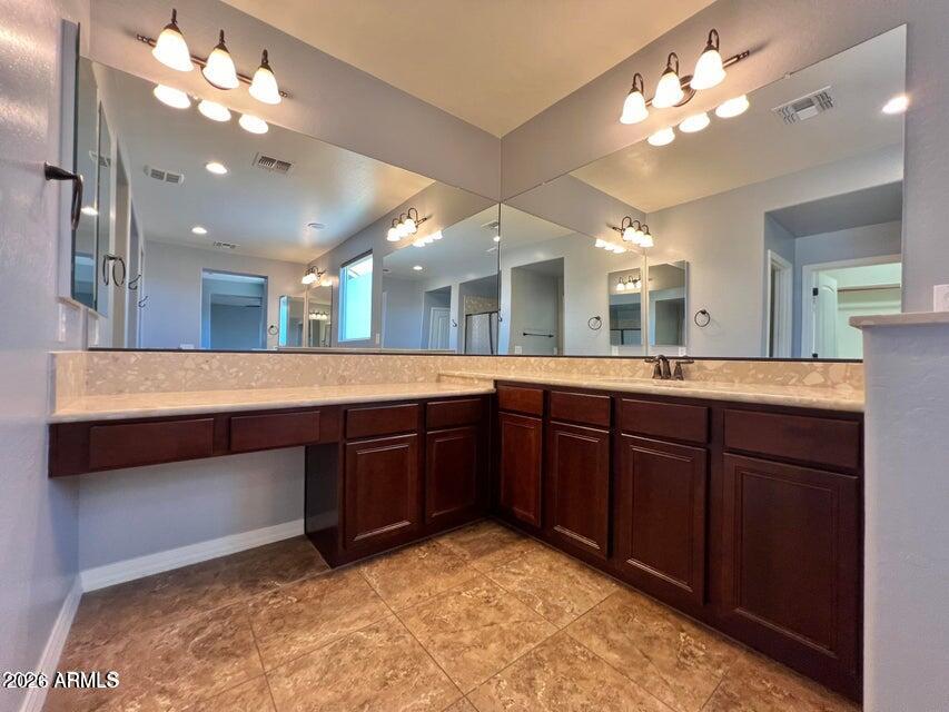 3886 East Rawhide Street Gilbert, AZ 85296 - Photo 41 of 52 a large bathroom with a large tub and sink