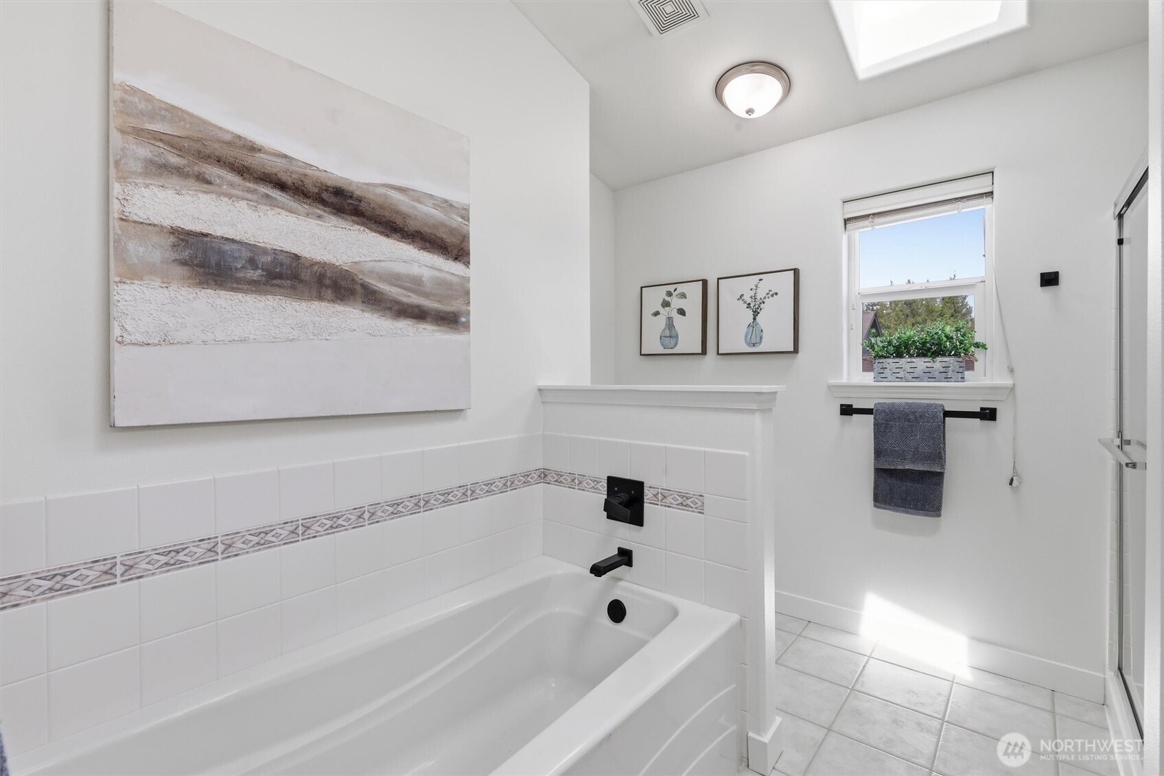 5523 East Wishon Road Snohomish, WA 98290 - Photo 24 of 39 a bathroom with a bathtub and a shower