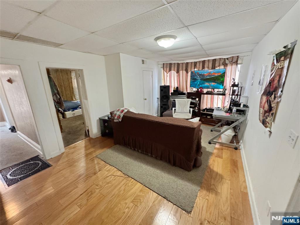 113 Kansas Street Hackensack, NJ 07601 - Photo 3 of 10 a living room with furniture and a flat screen tv