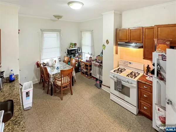 a kitchen with a stove and a refrigerator