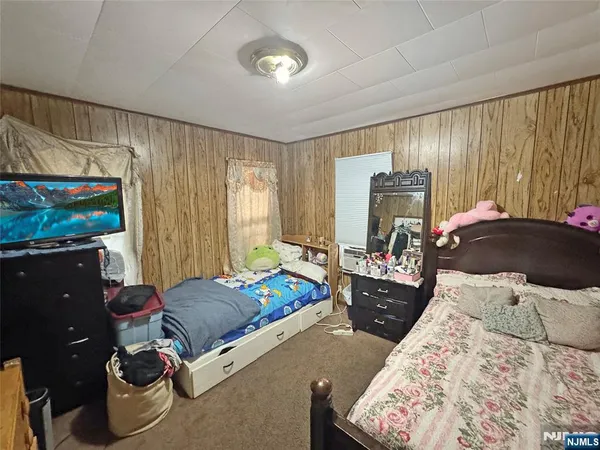 a bed room with a bed and furniture