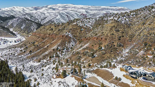 a view of a road with a building in the background