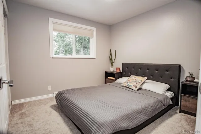 a bedroom with a bed and window