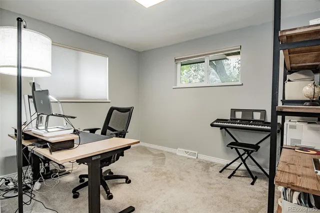 a view of a workspace with furniture