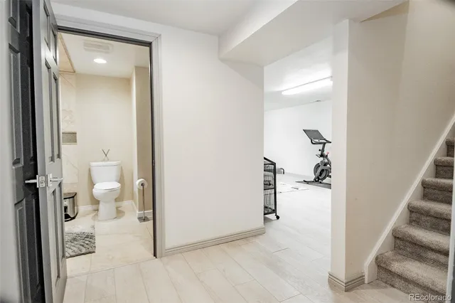 a view of a bathroom from a hallway