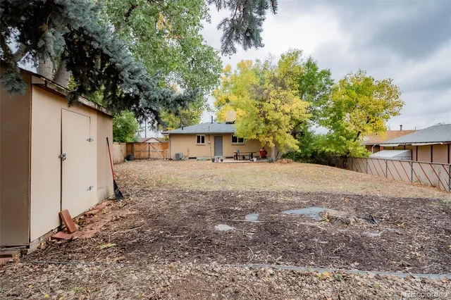 a front view of a house with a yard and a garage