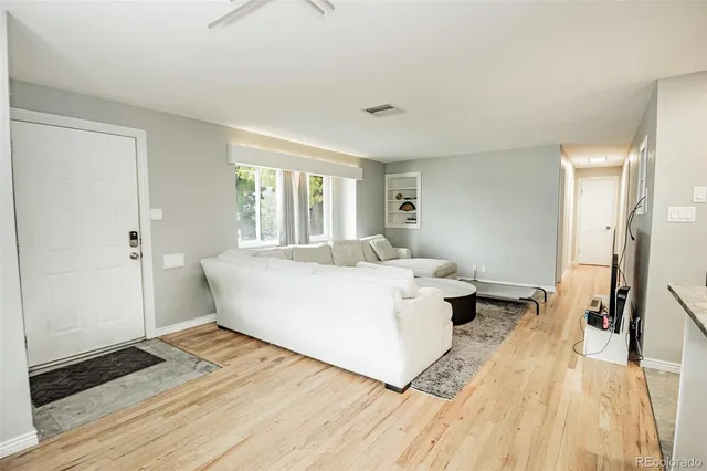 a living room with a couch and a table