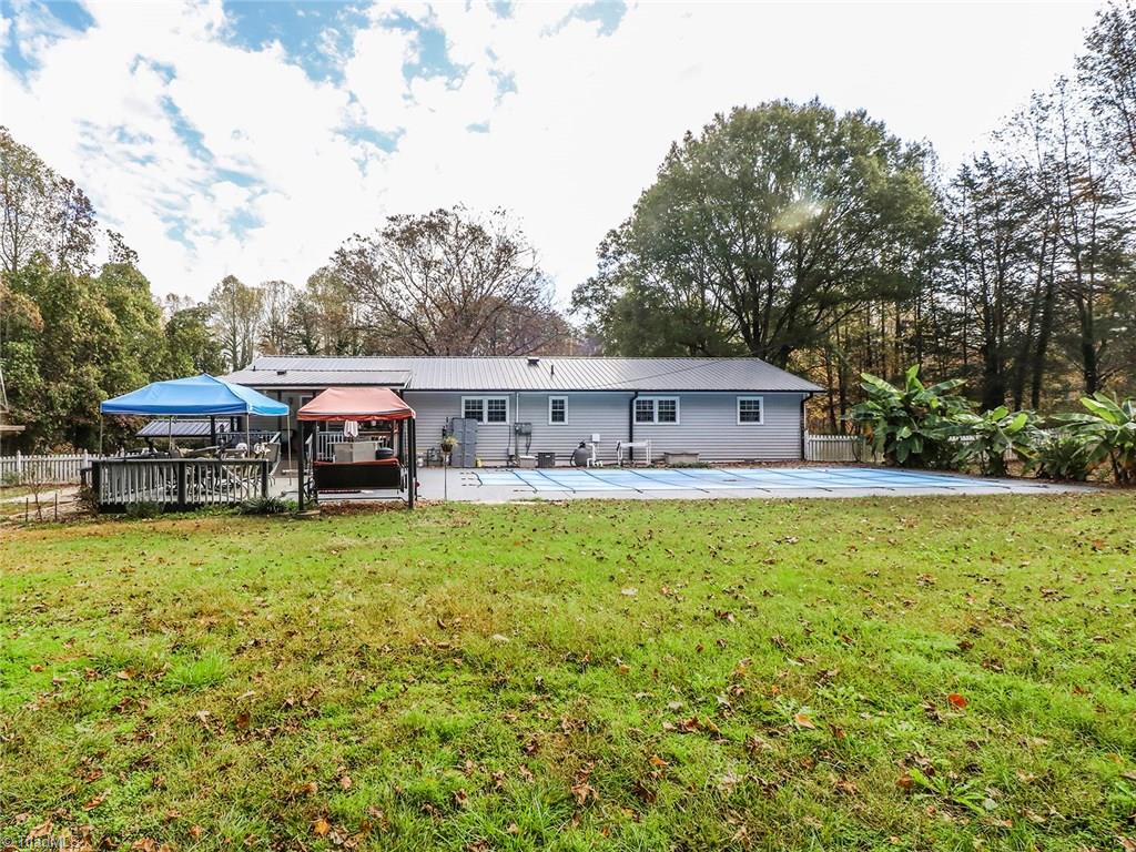 1624 Pecan Road Reidsville, NC 27320 - Photo 29 of 29 Exterior back view of deck and pool area. Fenced back yard.