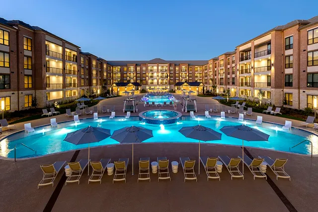 a view of a patio with swimming pool table and chairs